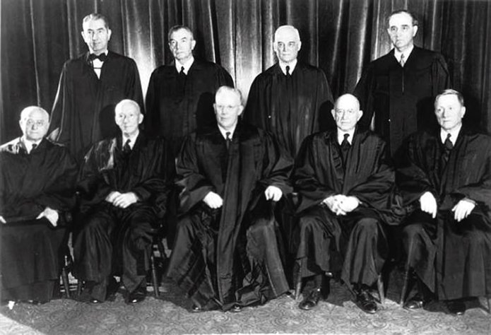 Nine US supreme court justices under Earl Warren wearing their robes.