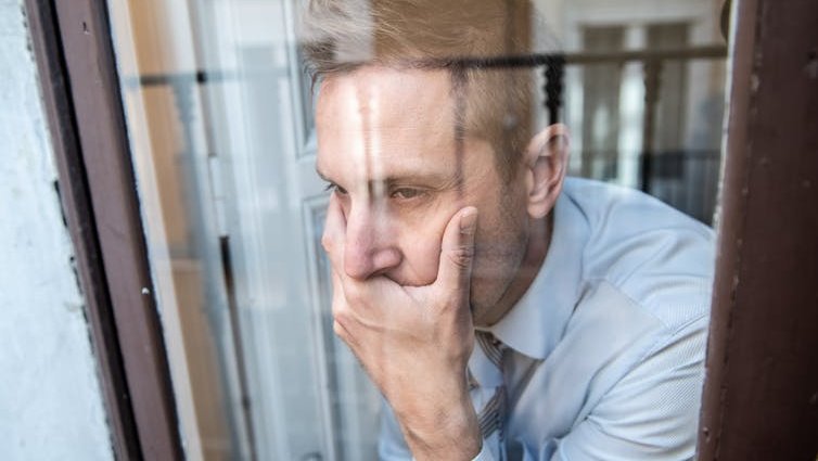 A man looking out of a window