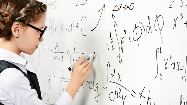 Girl doing maths at school