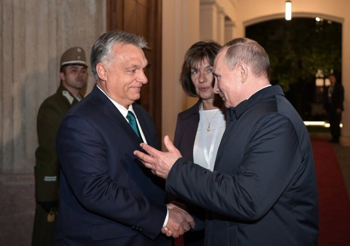 Hungarian prime minister Viktor Orbán, shakes hands with Russian president, Vladimir Putin, in Budapest, 2019.