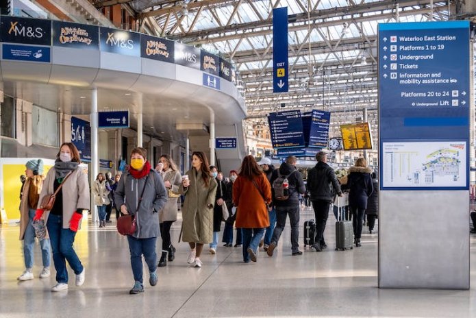 People walking through Waterloo station in London.