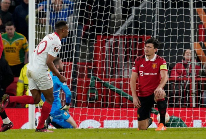 Harry Maguire of Manchester United dejected after scoring an own-goal to put Sevilla on level terms