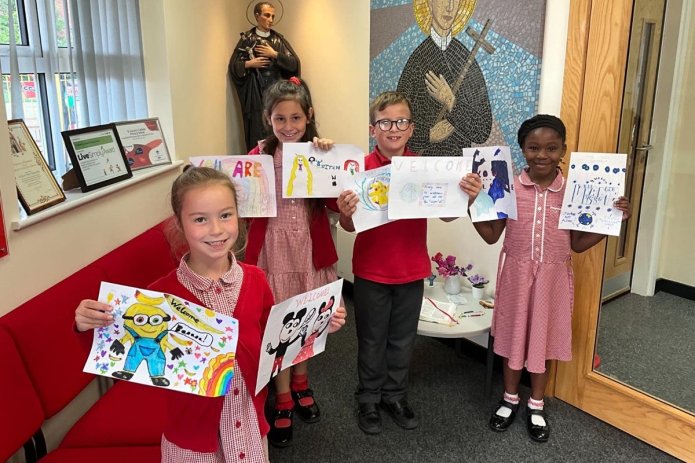 Primary school children take action after murals at refugee centre painted over