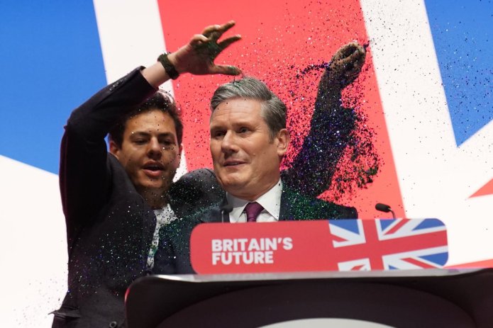 Security questions after Starmer’s speech interrupted by glitter protest