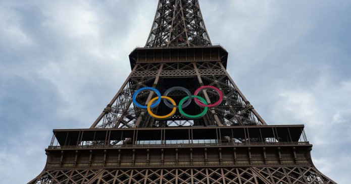 Eiffel Tower evacuated as man seen climbing it hours before Olympics ceremony