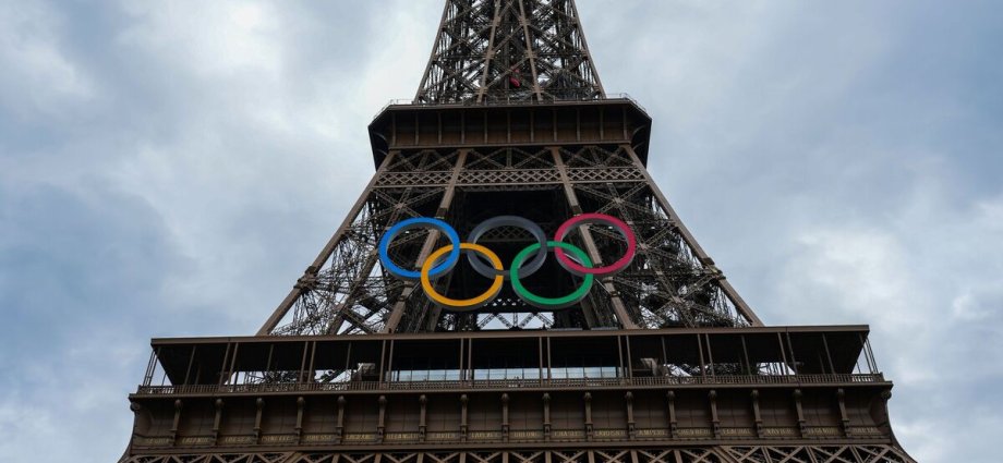 Eiffel Tower evacuated as man seen climbing it hours before Olympics ceremony