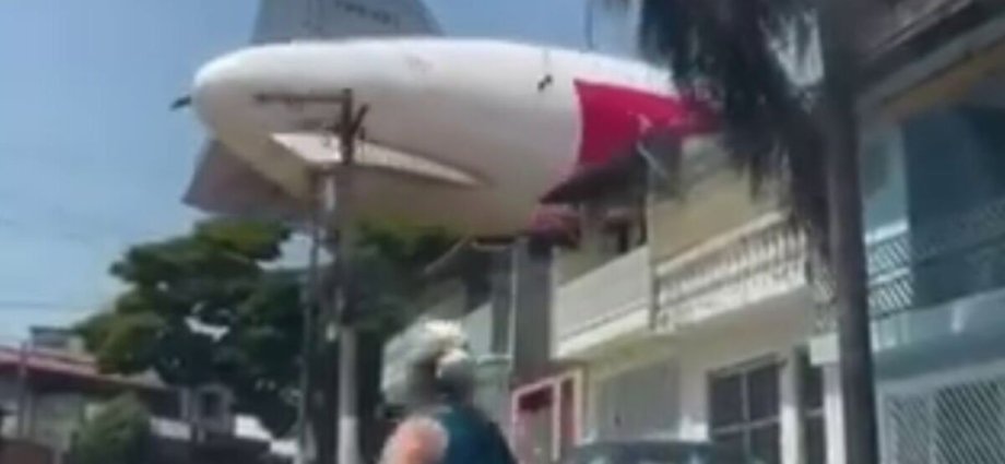 Blimp hired by football team crashes into row of houses in scary moment