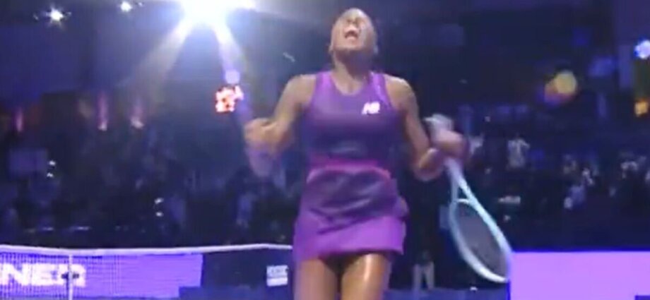 Coco Gauff lets out scream and drops to the ground after winning WTA Finals