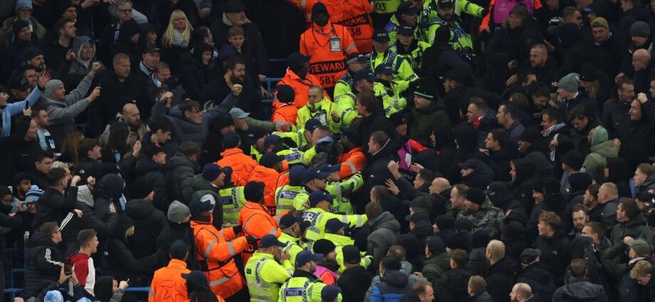 Man City and Feyenoord fans clash in Champions League tie as objects thrown