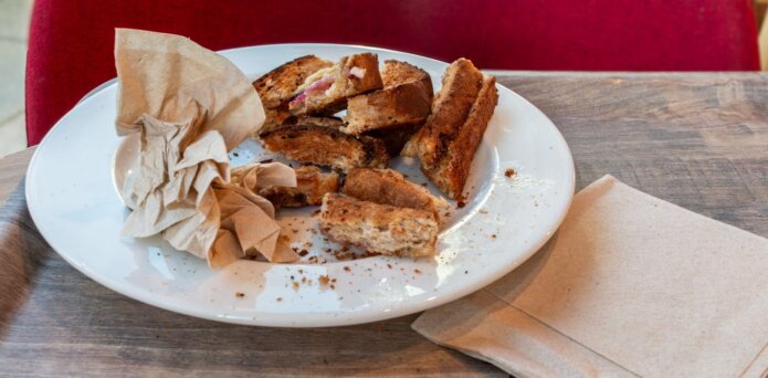 Bread crust stripes on a white wooden board.