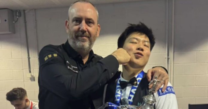 Mark Williams pictured 'punching' Zhao Xintong after World Championship final