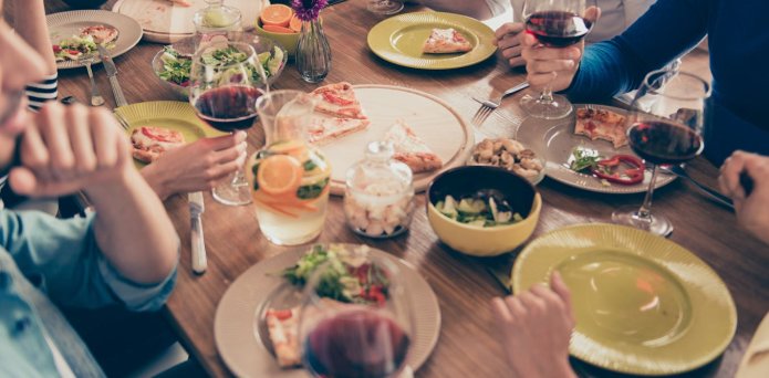A selection of different types of food laid out against a grey surface
