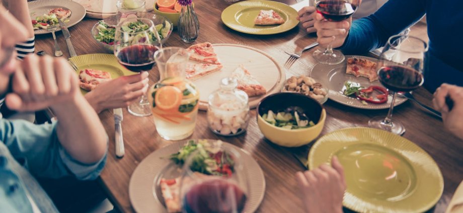 A selection of different types of food laid out against a grey surface