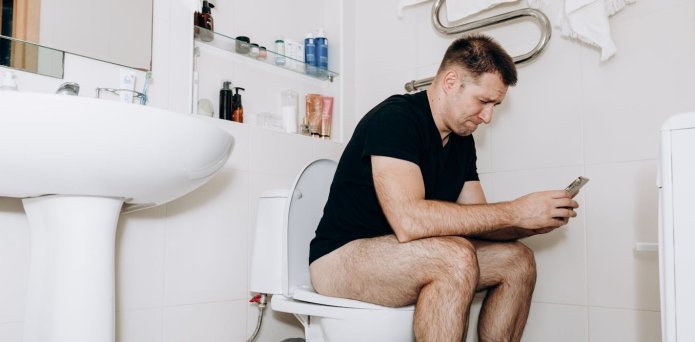 Seven health conditions that show why using your phone on the toilet is a bad idea