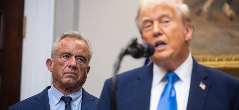 A Tylenol container with some Tylenol pills in the foreground.