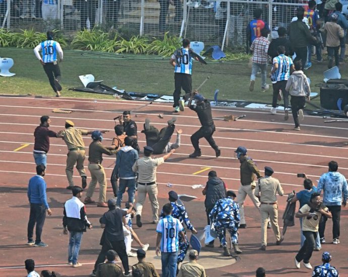 Lionel Messi's trip to India descends into chaos as fans launch pitch invasion