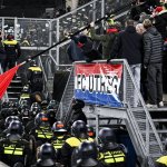 Europa League match delayed as riot police storm crowd and 1,400 fans sent home