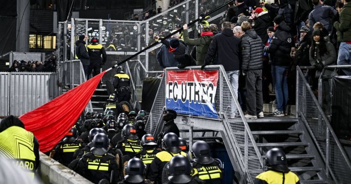 Europa League match delayed as riot police storm crowd and 1,400 fans sent home