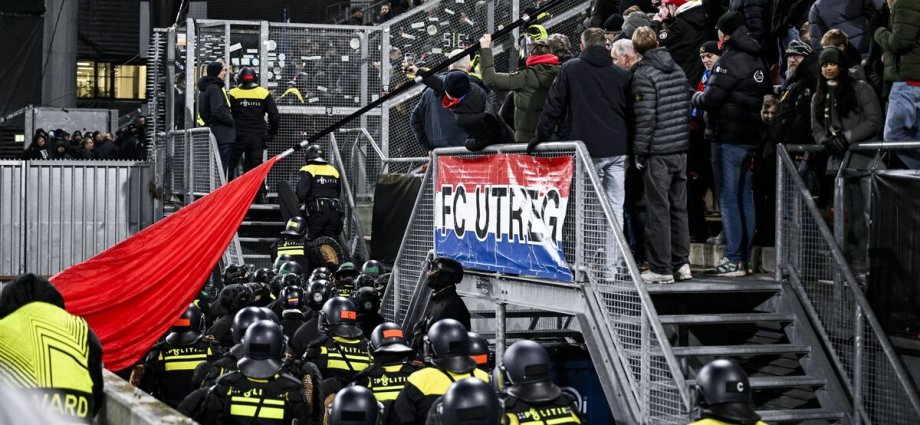 Europa League match delayed as riot police storm crowd and 1,400 fans sent home