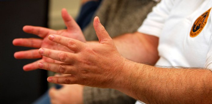 Close up of people in a group therapy session.