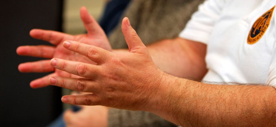 Close up of people in a group therapy session.